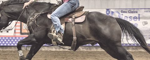 A rider running home after the third barrel