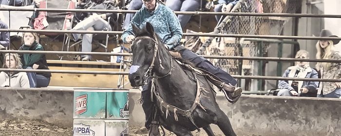 A barrel racer turning the first barrel