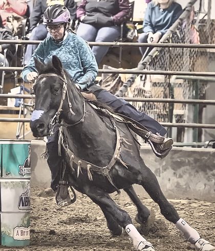 A barrel racer turning the first barrel